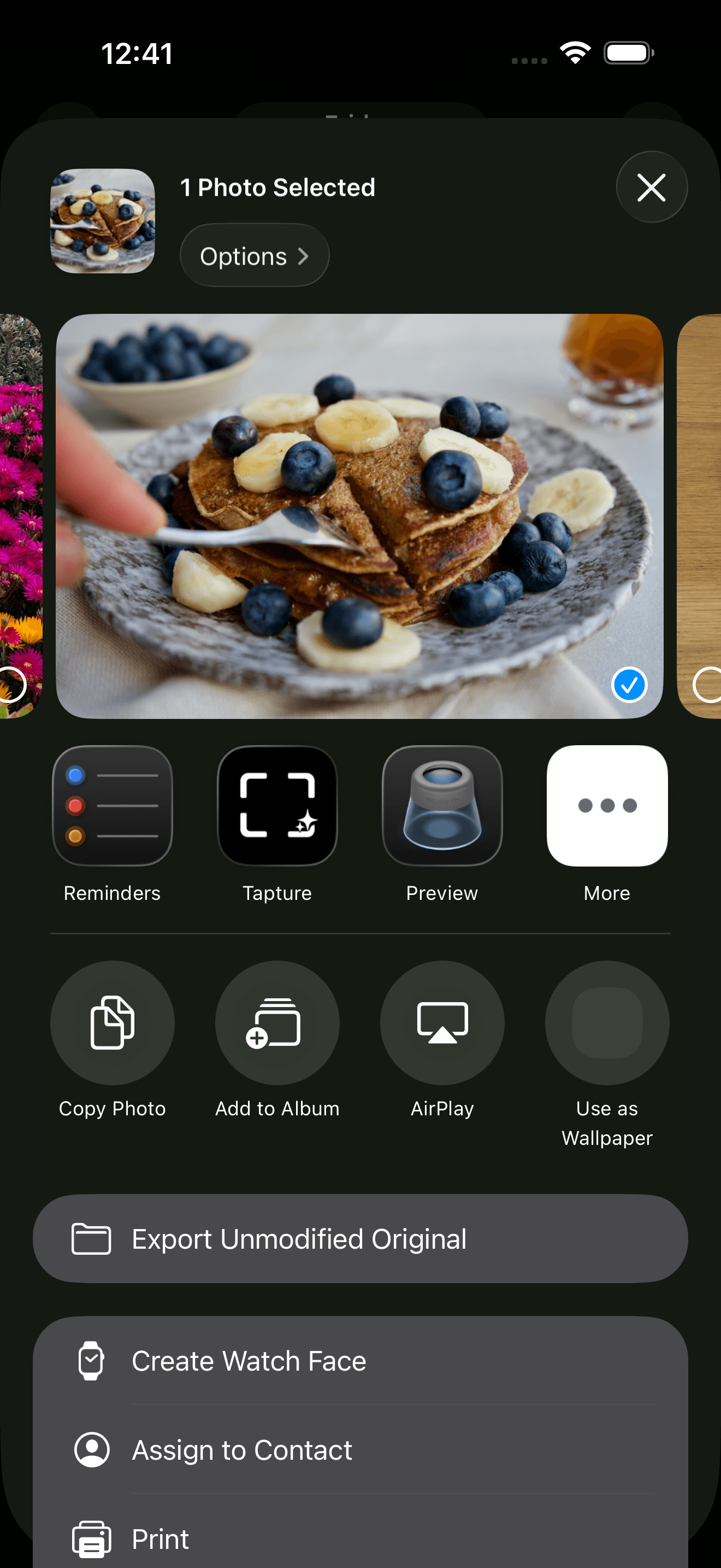 iOS share sheet showing Tapture as a share target for a photo
